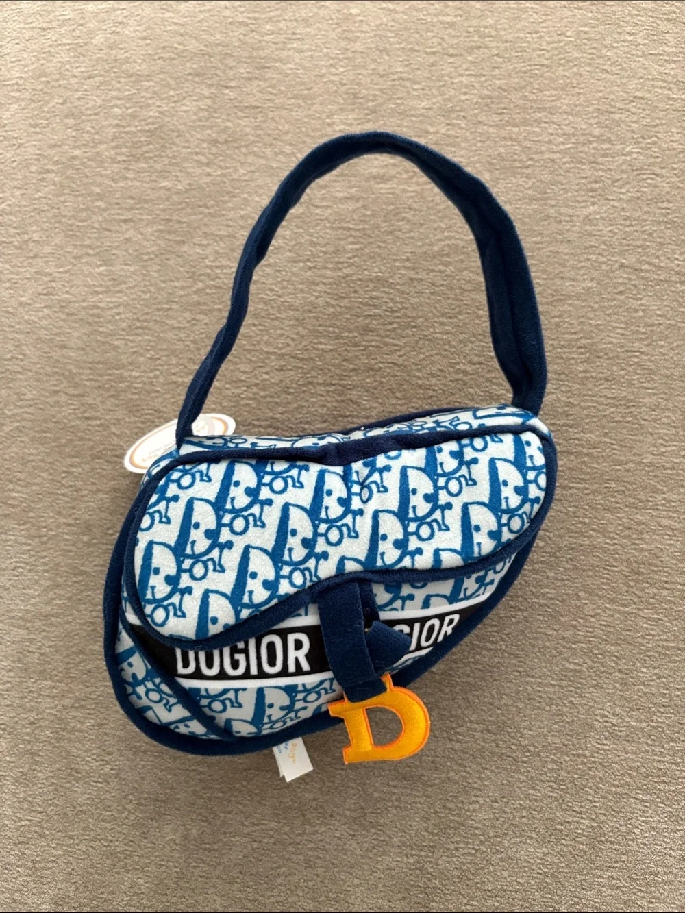 OGIO Blue Pattern Plush Dog Toy with Yellow 'D' Charm